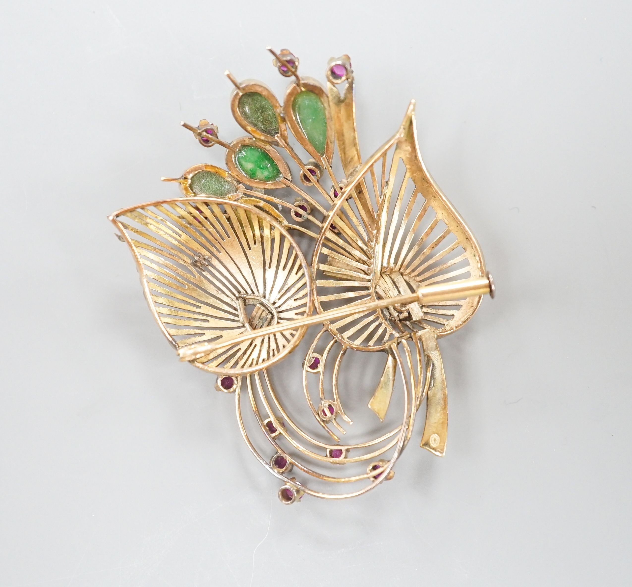 A yellow metal, jade and gem set floral spray brooch, 53mm, gross weight 13.9 grams.